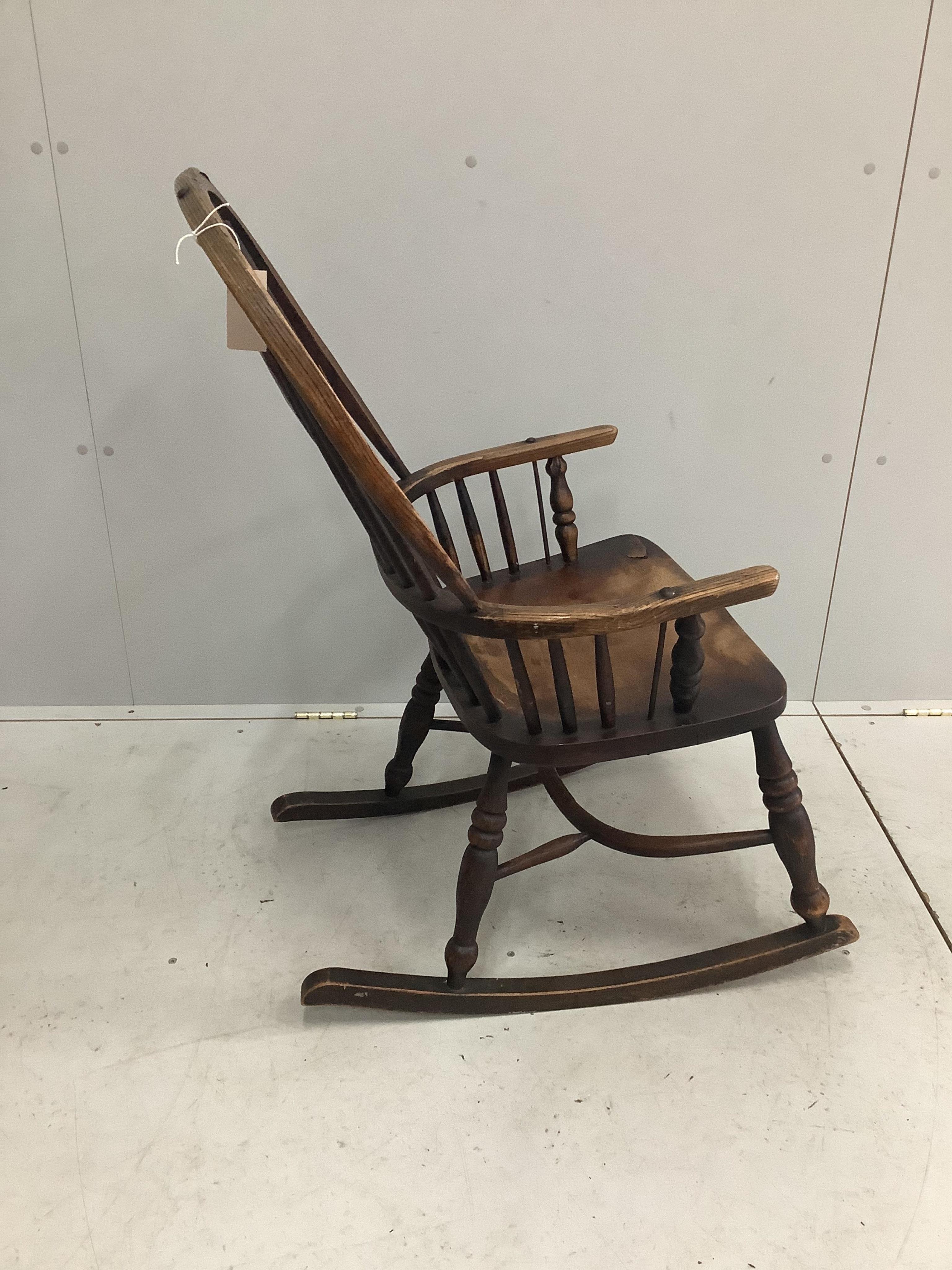 A 19th century ash, elm and beech Windsor rocking chair, width 53cm, depth 38cm, height 96cm. Condition - poor